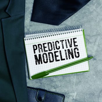 Hand writing sign Predictive Modeling, Business showcase maintenance strategy driven by predictive analytics