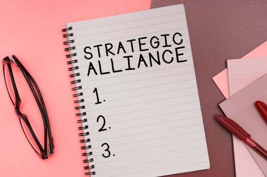 Hand writing sign Strategic Alliance, Business overview a bond between states, parties, individuals on goal achievement