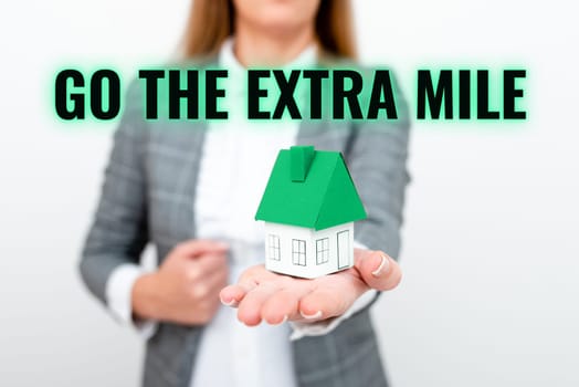 Sign displaying Go The Extra Mile, Word Written on advising person to see new places change his mood
