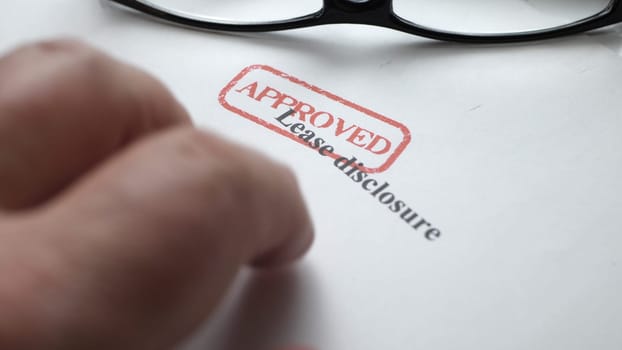 Finger tapping on lease disclosure form