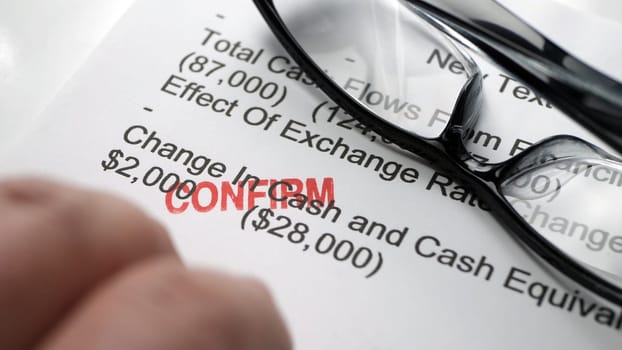 Finger tapping on financial report