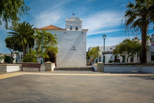 Yaiza, Lanzarote, Spain, March 2023: View on the church of Yaiza and Plaza de los Remedios on Lanzarote, Canary Islands