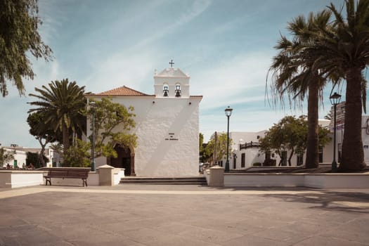 Yaiza, Lanzarote, Spain, March 2023: View on the church of Yaiza and Plaza de los Remedios on Lanzarote, Canary Islands
