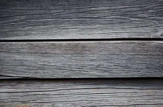 Wooden boards lying next to each other. A wood texture made of several wooden boards.