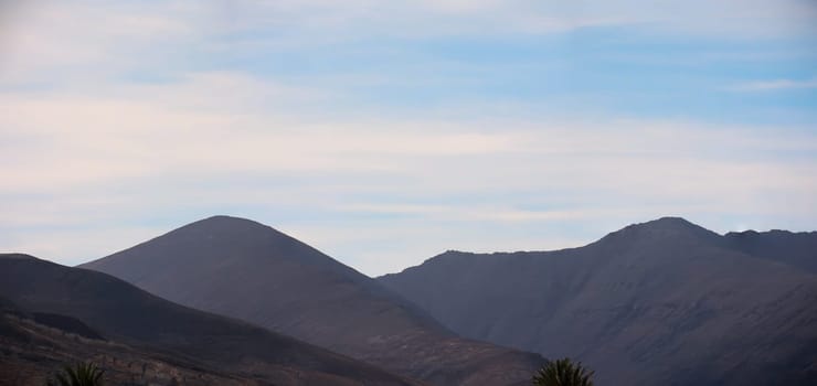 Many hills, mountains. A landscape shaped by volcanoes.