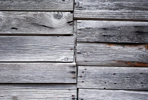 Wooden boards lying next to each other. A wood texture made of several wooden boards.