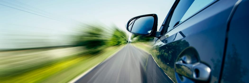 Car on the country road with motion blur background