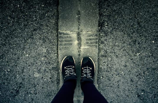 Detail of legs of young woman on a street in the city, walk and health