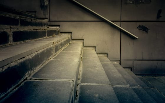 Detail of modern exterior staircase in the city, decorated with natural stone