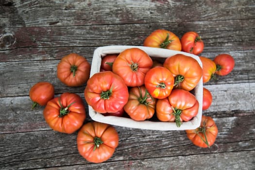 Vegetables, tomatoes on wooden desk