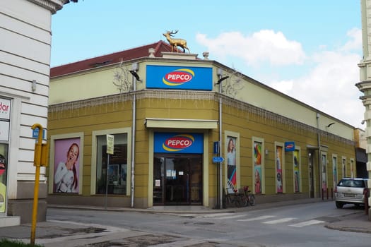 Sremska Mitrovica, Serbia, March 16 2023 A signboard with a name and logo of network stores Pepco above an entrance to a shop. Pepko banner. Women's shop with economical prices. Pepco chain in Serbia.