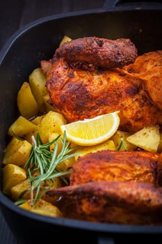 Tasty roasted pork meat with potatoes and vegetable