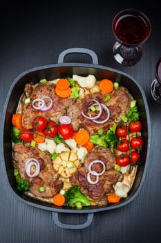 Tasty roasted pork meat with mushrooms and vegetable