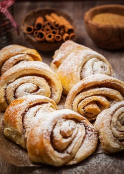 Homemade cinnamon rolls on wooden table