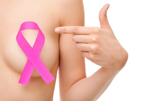 Woman with a pink breast cancer awareness ribbon