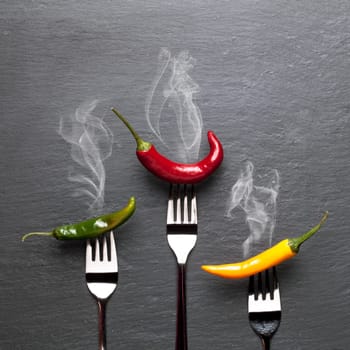 steaming colorful chili peppers