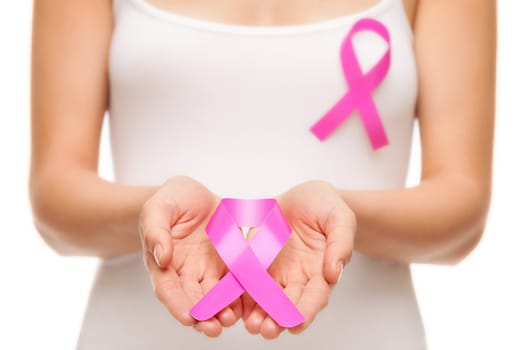 Woman with a pink breast cancer awareness ribbon