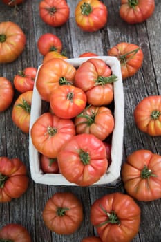 Vegetables, tomatoes on wooden desk