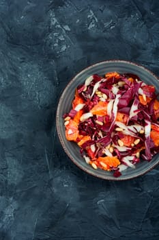 Freshly salad with chicory, orange and pine nuts. Radicchio salad