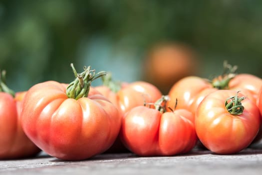 Vegetables, tomatoes on wooden desk