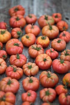 Vegetables, tomatoes on wooden desk