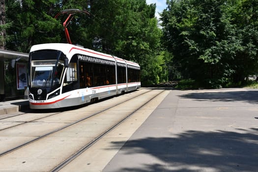 Streetcar in the middle of a green park in Moscow, Russia