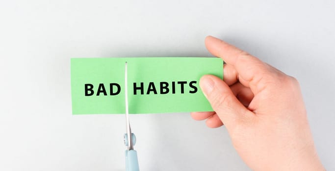 Bad habits sign cut with scissors, break a habit, stop smoking, quit drinking alcohol and unhealthy eating