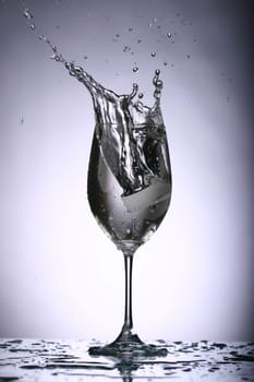 alcohol splash on gray background