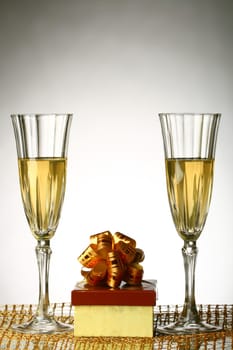 holiday card golden champagne and gift