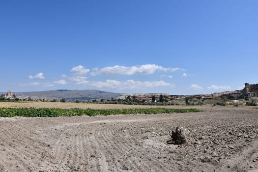 Fields and sandy paths next to Cavusin in Cappadocia, Turkey