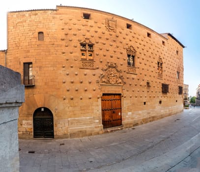 One of the facades of the Casa de las Conchas building in Salamanca (Spain).