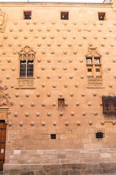 One of the facades of the Casa de las Conchas building in Salamanca (Spain).