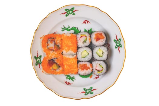 Traditional japanese sushi menu. Close-up of various kinds of sushi rolls with salmon, sashimi and other slices of raw fish served on a colorful plate. Clipping path. Macro. Top view.