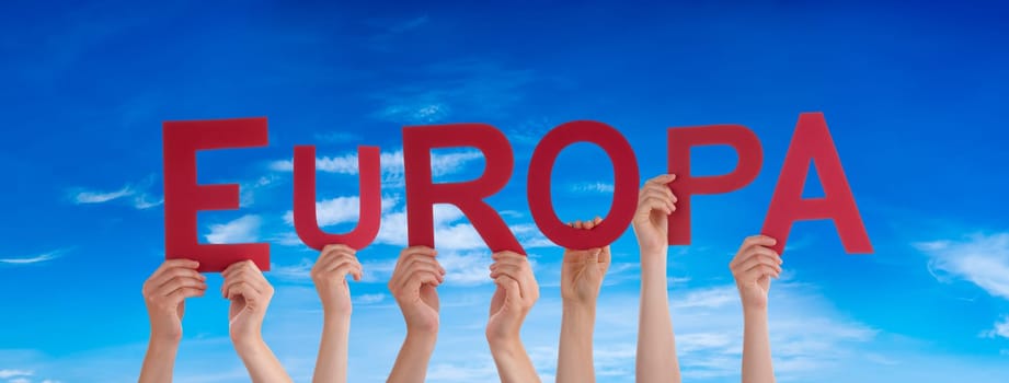 People Or Persons Hands Building German Word Europa Means Europe. Blue Sky As Background.