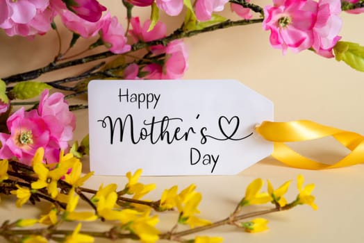 Spring Flower Arrangement With White Label With English Text Happy Mothers Day. Colorful Flower Branch Decoration With Yellow And Purple Blossoms.