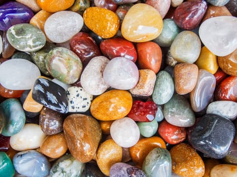 Full framed close-up view of round cut and polished mineral stones.