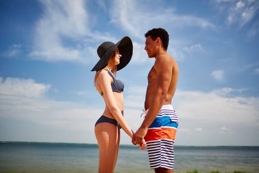 Amorous couple spending vacation by the sea