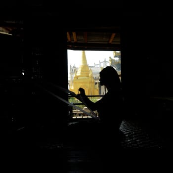 a padaung women in a traditional weaving workshop Factory near the Village of Phaung Daw Oo at the Inle Lake in the Shan State in the east of Myanmar in Southeastasia.