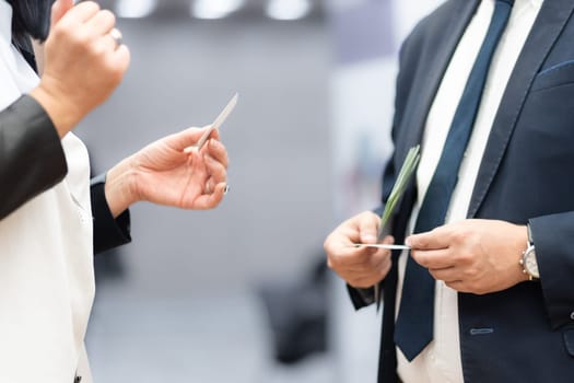 Business people exchanging business card on business meeting, Business discussion talking deal concept.