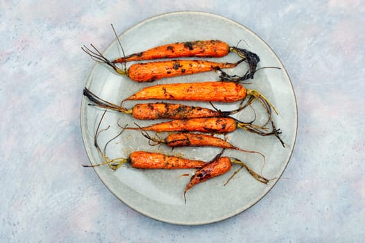 Fried carrots with herbs and spices on the plate