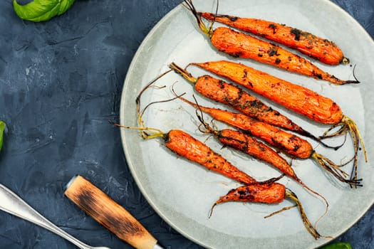 Fried carrots with herbs and spices on the plate