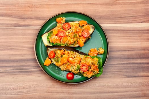 Eggplant stuffed with pumpkin, quinoa and tomato.