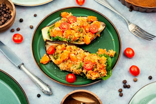 Eggplant stuffed with pumpkin, quinoa and tomato.