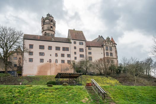 View of the beautiful Ronneburg Castle during cloudy day, meadow in front, low angle view Germany