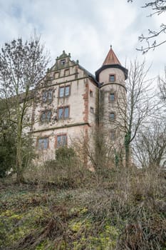 Round Tower attached to an old building at Ronneburg Castle, Germany, cloudy day low angle view