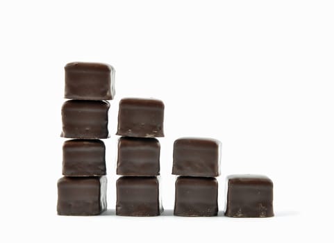 Dominosteine lined up in stacks on white background