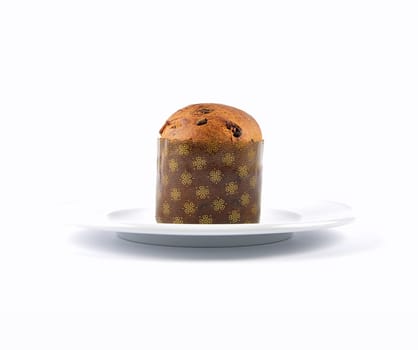 Paper shaped chocolate muffin on plate and white background