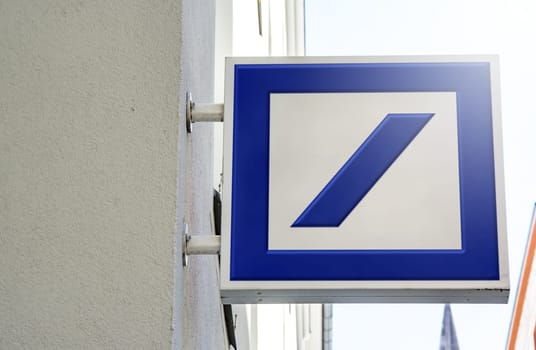 Munich, DE, March 2023: logo of Deutsche Bank on a square metal sign outside a building. Deutsche Bank is a German multinational investment bank. Illustrative editorial. Financial and economics