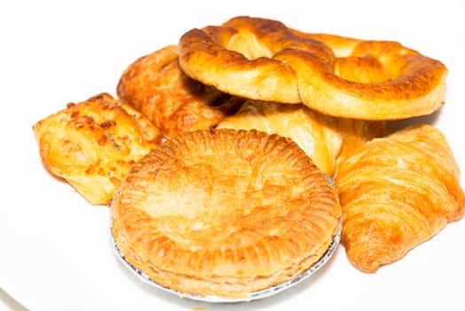 Pie and bakeries on white plate
