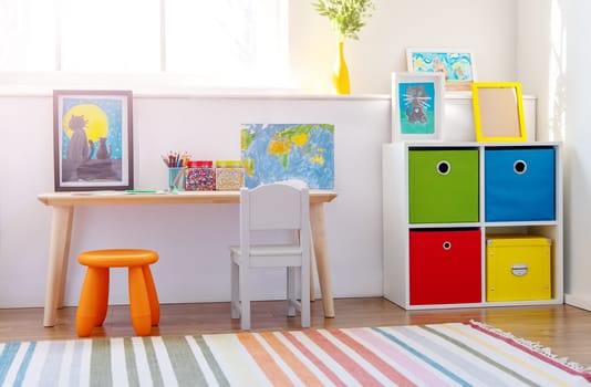 Comfortable room with colourful furniture in sunny day. Concept of the child room and kindergarten.